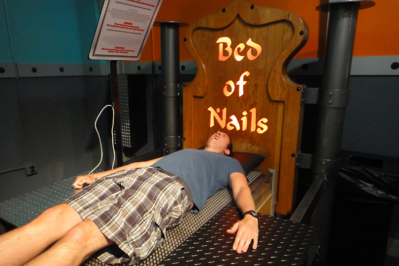 Test your endurance on the Bed of Nails at Wonderworks, Orlando