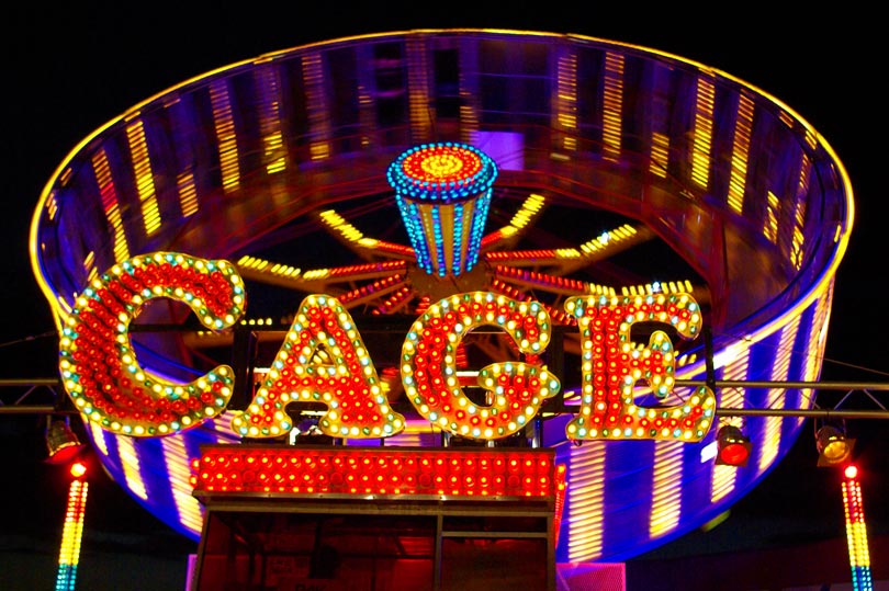 Fun photo challenge - Cage funfair ride lit up at night