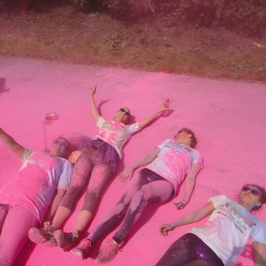 Rolling in pink powder on the colour run