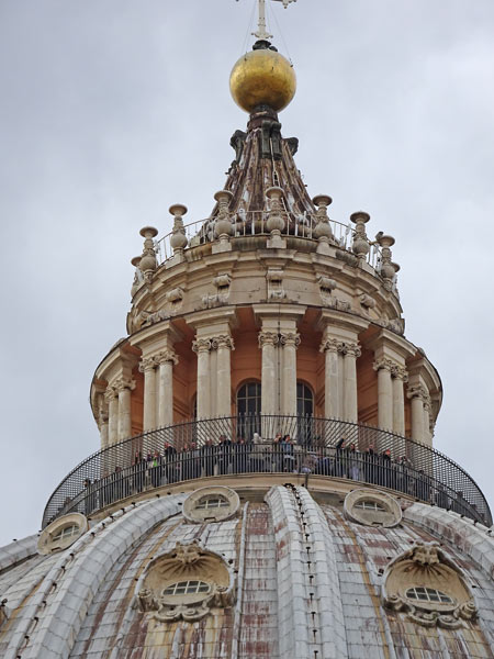 People standing at the highest point of the climb at the top of the dome (St Peter's Basilica)