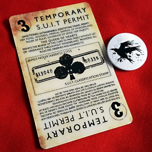 Alice's Adventures Underground card and badge