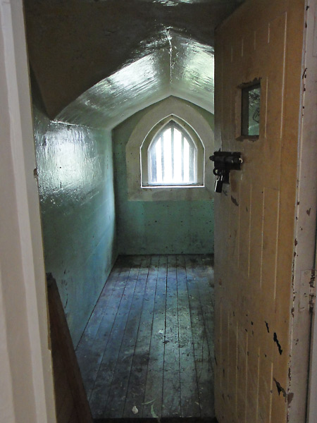 Original old jail cell in what is now a prison themed hostel