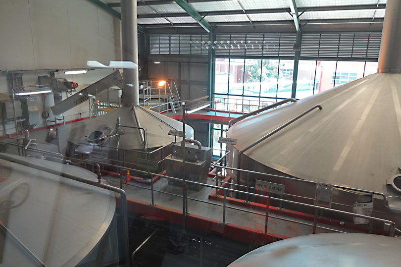 Beer on the conveyor belts at the XXXX brewery in Queensland